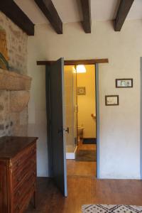 a room with a door open to a bathroom at Gîte Charlange in Pradelette