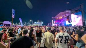 a large crowd of people at a concert at night at Brisa Apartment in Burgas +36 photos