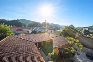 a roof of a house with the sun in the sky at BG Stone Homestay in Mộc Châu +68 photos
