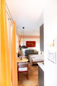 a living room with a couch and a table at Entspanntes Design-Studio an der Karli in Leipzig
