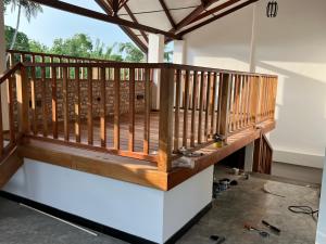 a deck being constructed on the side of a house at SSK Rent Villas in Matara