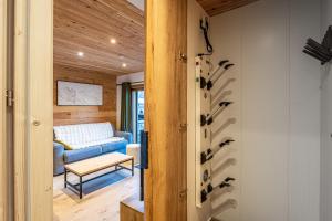 a living room with a blue couch and a table at Appartement Marmotte in Méribel