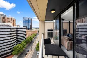 a balcony with a view of a city street at Urban Oasis City 2 Bed Apartment Oaks Horizons in Adelaide