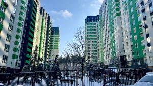 a group of tall buildings in a city at City Park Irpin - four in Irpin