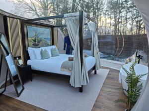 a bedroom with a bed and a swing at Cromore Retreat in Portstewart