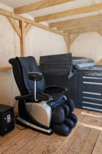 a chair sitting in a room with a pile of gloves at Domek u Anitki i Nikosia in Jeleśnia