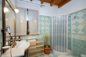 a bathroom with a shower and a sink and a tub at Tri Re e 'na Regina in Cinisi +112 photos