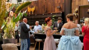 a bride and groom standing in front of a buffet at Hotel Lautrup Park in Ballerup