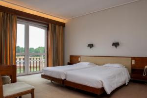 a bedroom with a large bed and a large window at WOT Pateira Soul in Fermentelos +58 photos