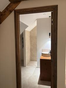 a bathroom with a sink and a mirror at L'Orée du Peney in Saint-Jean-dʼArvey +48 photos