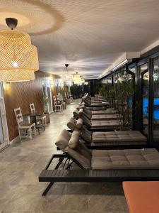 a row of chaise lounges in a hotel lobby at La Mosie in Haţeg