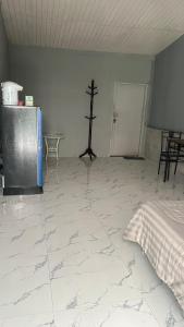 a room with a bed and a cross on the wall at Similan Resort & Water Fall in Ban Lam Ru (1) +6 photos