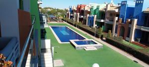 a view of a swimming pool on the side of a building at Royal Park Green Spa in Orihuela Costa