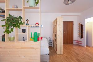 a room with wooden shelves and a door at Bindarella ai Navigli in Milan