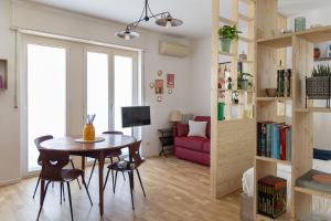 a small living room with a table and a couch at Bindarella ai Navigli in Milan