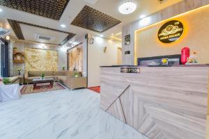 a lobby of a restaurant with a reception counter at INDRA PALACE Unit 2 in Jaipur