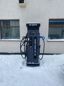 a no group gas pump sitting in the snow at SPA-Hotel Dodo in Zhytomyr