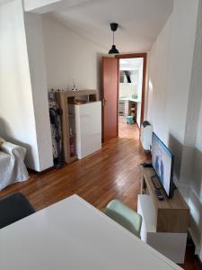 a living room with a desk with a computer on it at Ca baracot in Lanzo Torinese