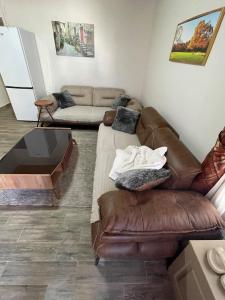 a living room with a couch and a table at Kıymet Aydogdu in Alaçatı