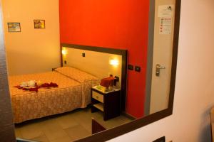 Postel nebo postele na pokoji v ubytování Hotel Airone