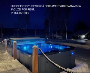 a swimming pool in the snow at night at Kolin Aamuranta in Kolinkylä