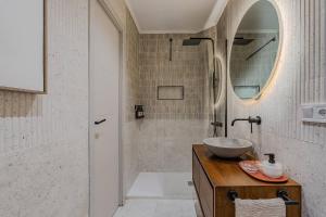 a bathroom with a sink and a shower at NEW Refurbished Modern Apartment in Barcelona +27 photos
