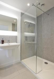 a bathroom with a glass shower and a sink at 3 Bed in Snape oc-2wadd in Snape +8 photos