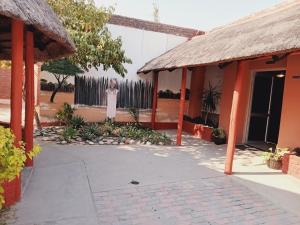 a boy standing in the courtyard of a building at Punyu International Hotel 