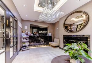 a store lobby with a fireplace and a mirror at Park Avenue Baker Street in London