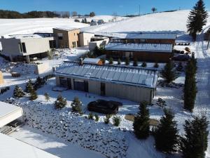 an aerial view of a building in the snow at Chalet Rufux in Dolná Lehota