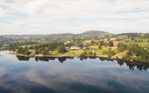 a view of a lake with hills in the background at The Brackenrigg Inn in Watermillock
