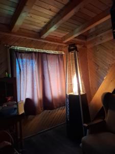 a room with a window with a light on it at Vikendica Tavna in Bijeljina