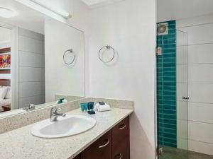 a bathroom with a sink and a shower at Fiji superbe views in Ndenarau Island