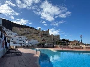 a large swimming pool in front of a building at Panoramic View Balcón del Atlántico in Adeje