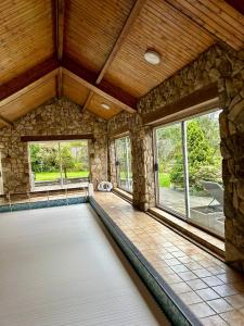 a room with a swimming pool in a house at Alloa in Newby Bridge