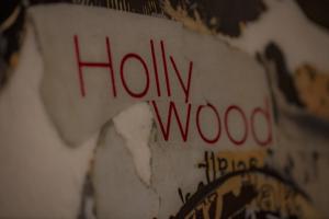 a sign with the words holly woolly on a wall at Hotel Zur Feldmühle in Arnsberg