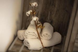 a group of towels with flowers on them at Hotel Zur Feldmühle in Arnsberg