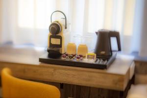 a table with a coffee maker on top of it at Hotel Zur Feldmühle in Arnsberg