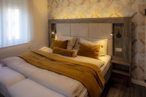 a bedroom with a large bed in a room at Hotel Zur Feldmühle in Arnsberg +16 photos