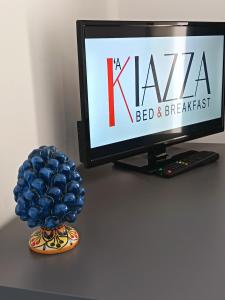 a computer monitor and a blue ball on a table at B&B A' Kiazza in Buompietro