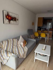 a living room with a couch and a table at Sunny Escape in El Campello in El Campello