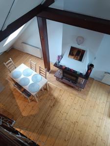 an overhead view of a living room with a table and chairs at Paula Apart in Wadowice