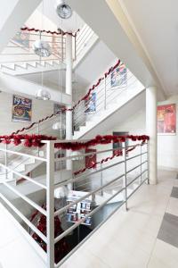 a staircase in a building with red decorations at Hostel CENTRUM in Radom