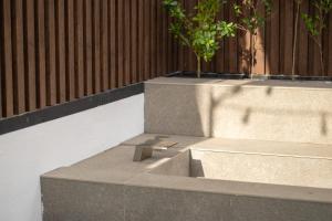 a concrete step with a plant on top of it at 루아호텔 in Seoul +60 photos