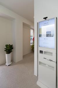 an empty office with a large screen in a room at 루아호텔 in Seoul