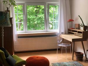 a room with a desk and a window at Villa des Bois Sauvages in Liège