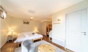 a bedroom with a white bed and a table at Maison Caramel Chalet in Landry +15 photos