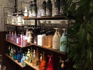 a shelf filled with different types of bottles at 水戸PARCO in Mito