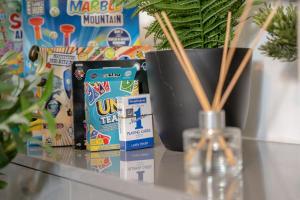 a counter with a potted plant and a vase with a plant at Family-Friendly 2-Bed Home with Games & Fireplace in Colne +16 photos