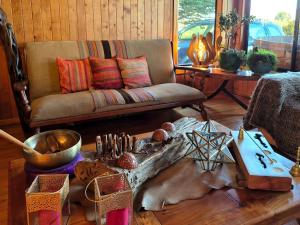 a living room with a couch and a table at Hostal Boutique El Vergel Azul in Castro